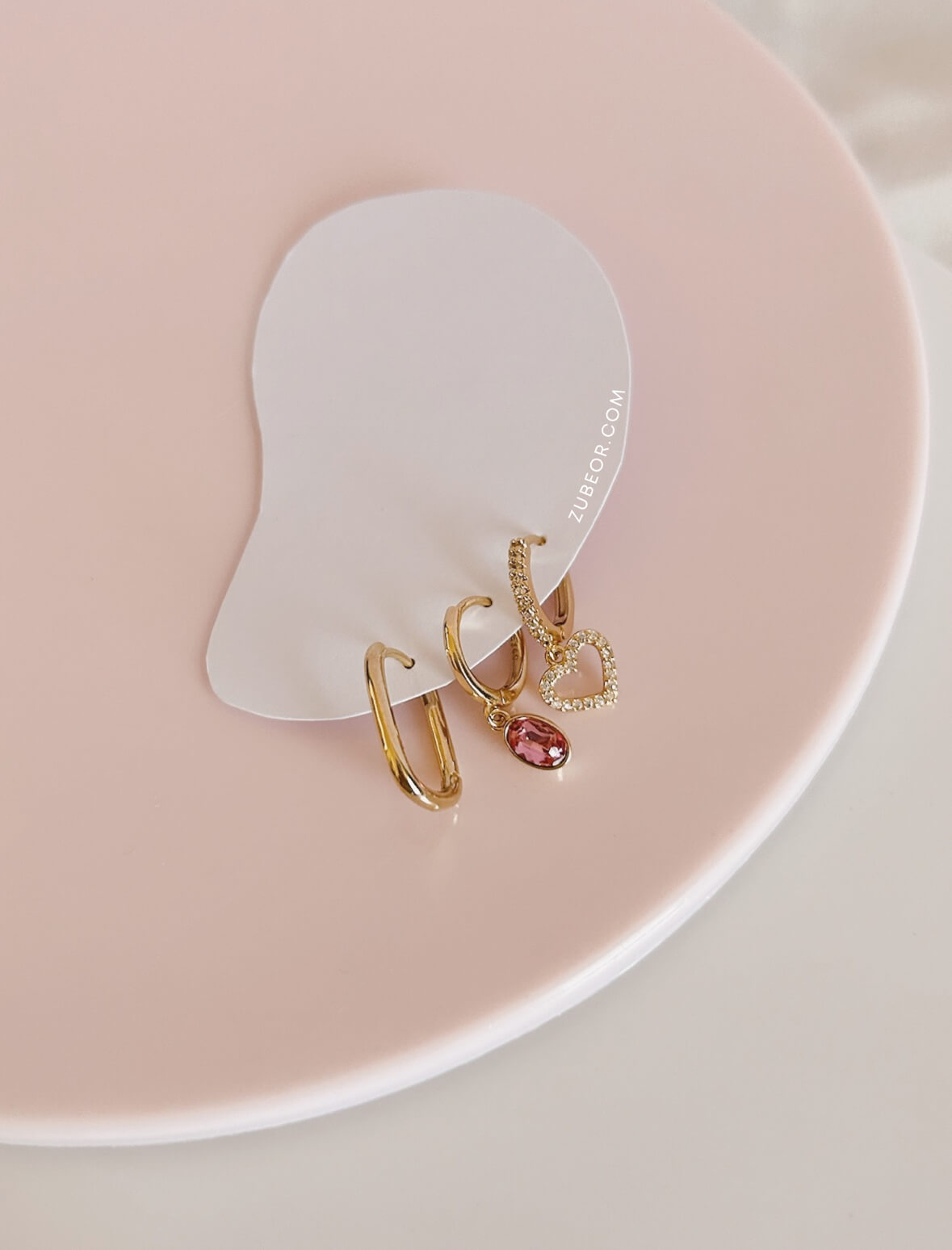 Set de aretes impares corazón y fucsia 3